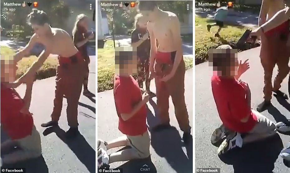 Disturbing video of boy held at gunpoint.